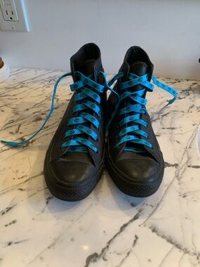 Woman’s Converse Black High-Top Sneakers with Blue Laces